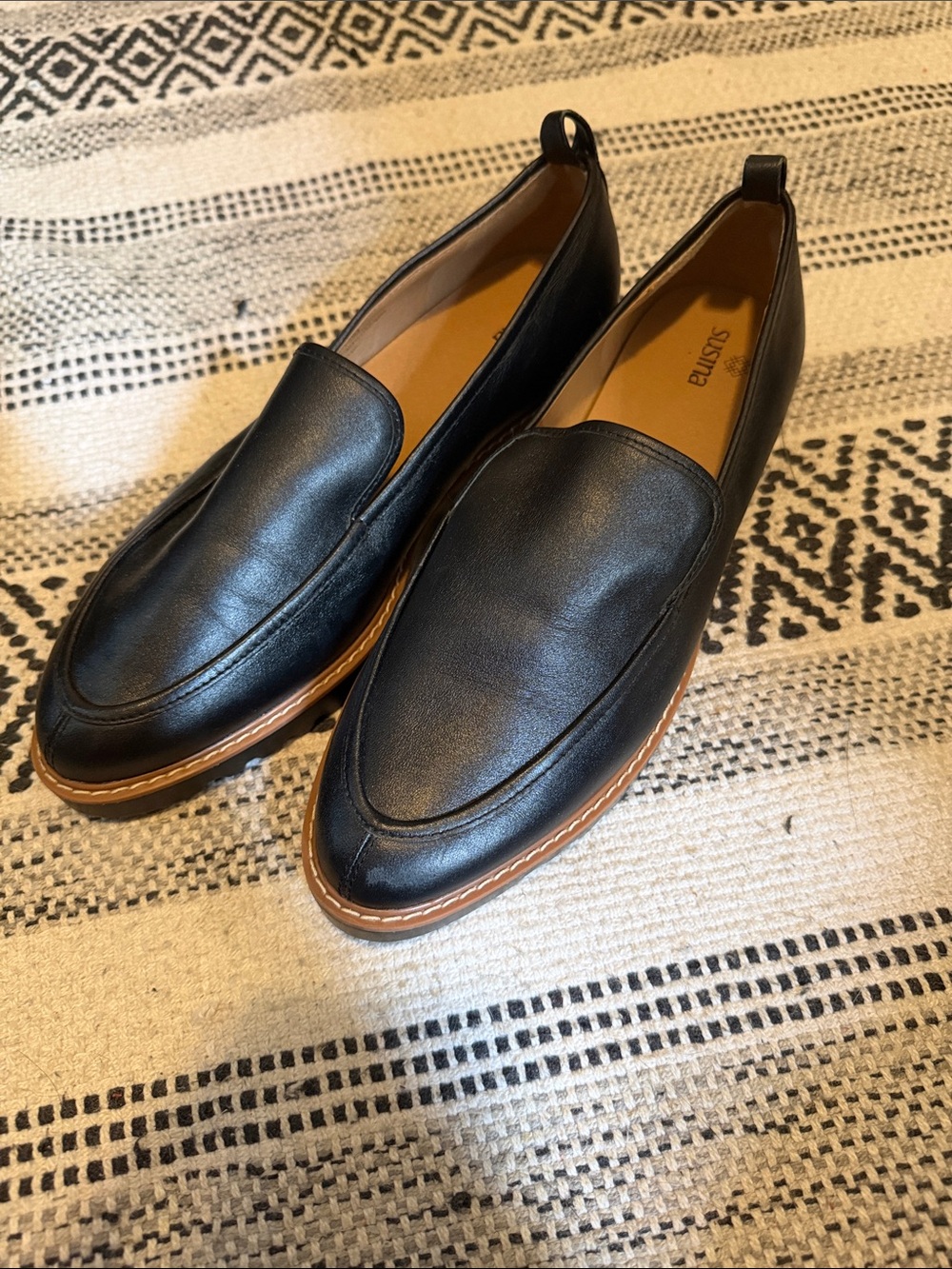 Susina Black Leather Slip-On Loafers with Tan Welt